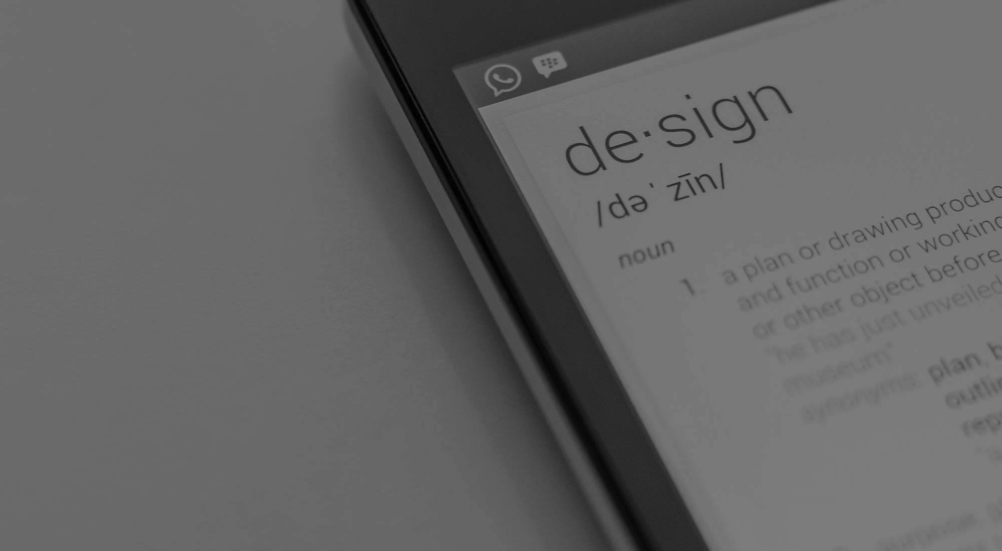 zoomed in version of a mobile with the word design on the screen