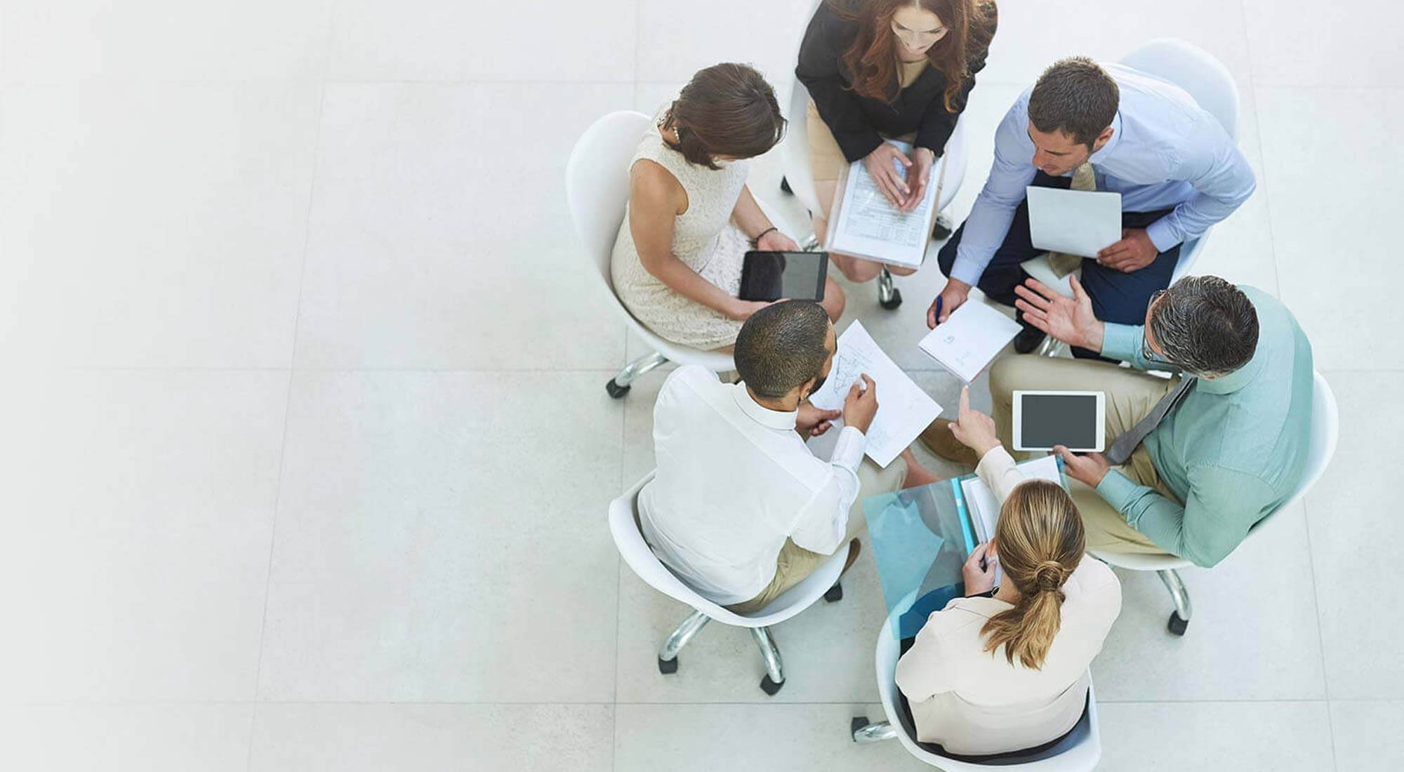 people working around a rounded table