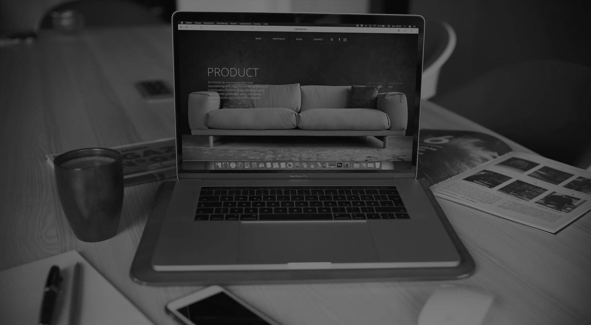 macbook which has a website of a sofa
