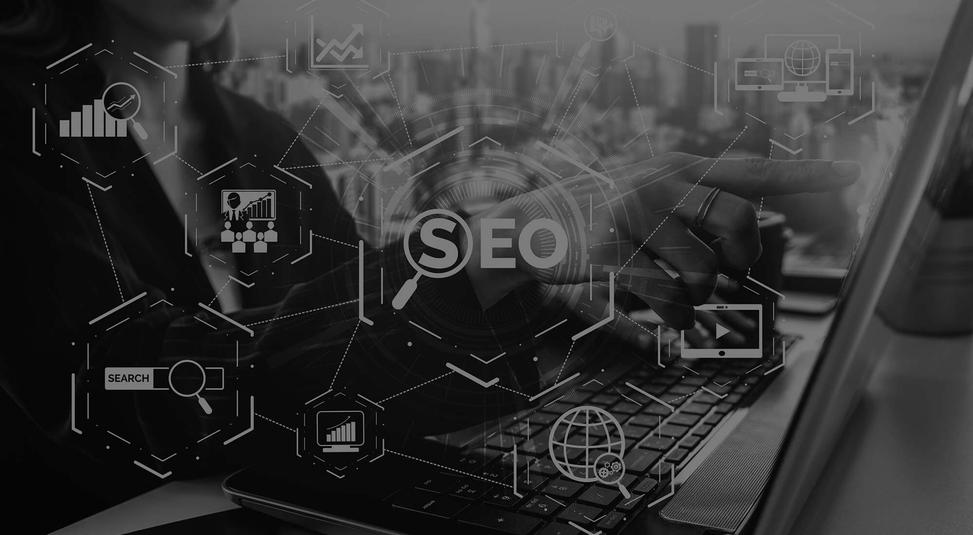 woman pointing on screen with word seo in the middle