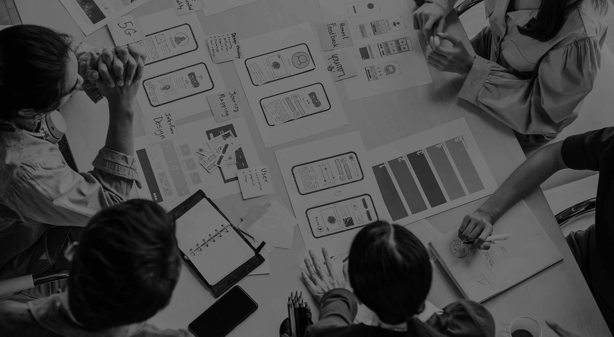 a team discussing mobile designs